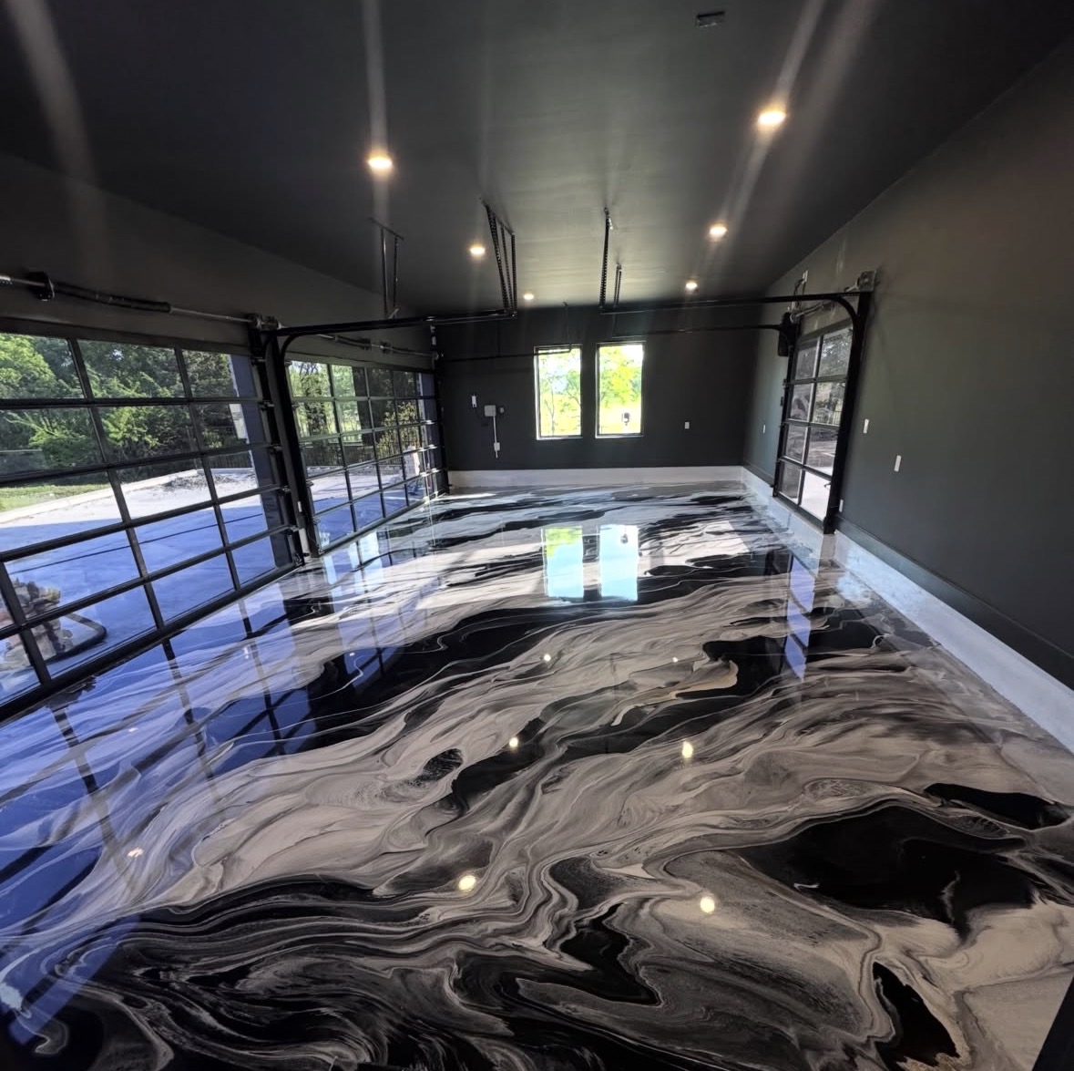 Black, white and grey marbled metallic epoxy garage floor